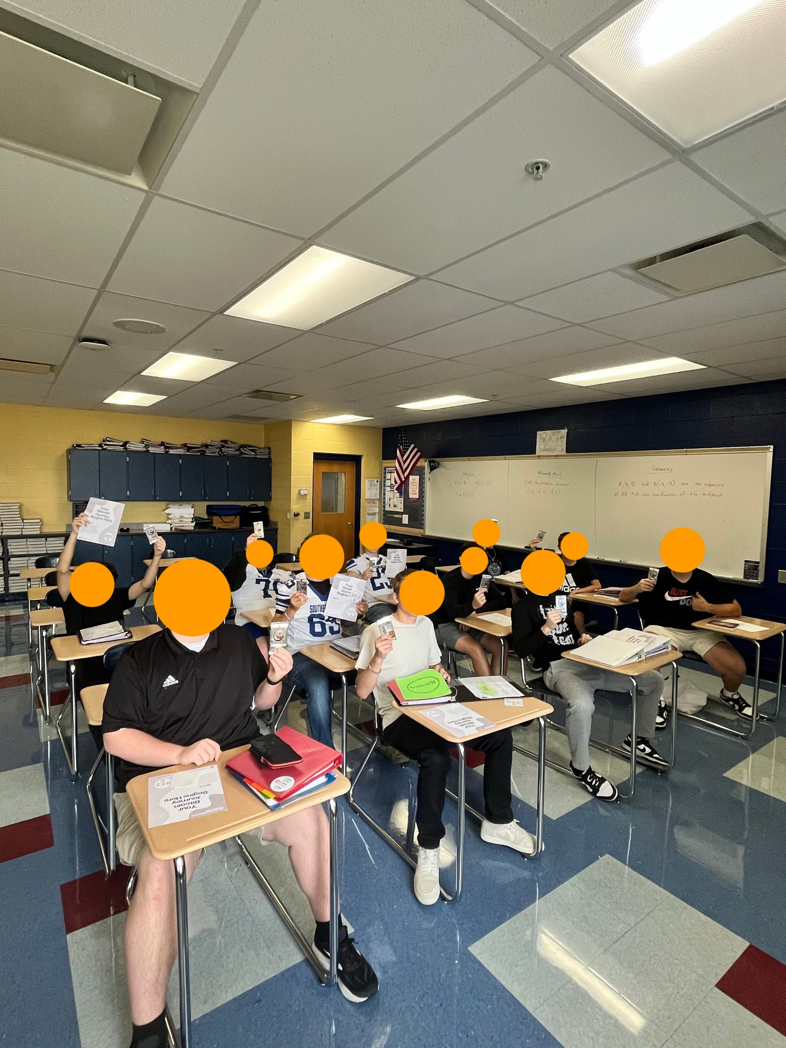 Students in a classroom learning Bitcoin with foundation materials